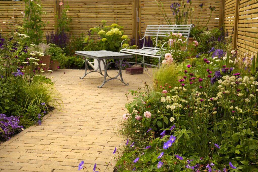 Our Gromo Antica Clay Pavers create a charming effect in this courtyard design. 