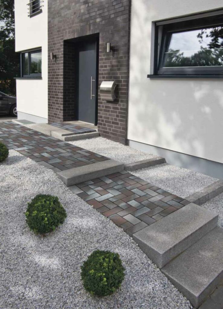 Our Delta Blue Brown clay pavers are used to create a modern style pathway to the entrance on this home. 